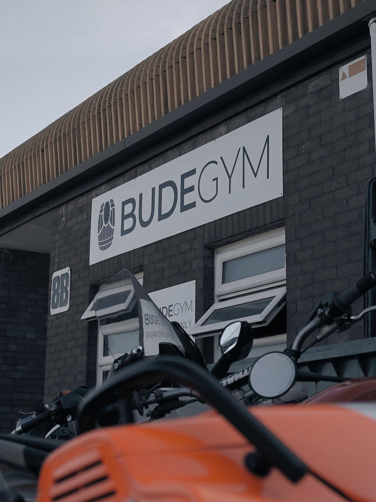 The front of Bude Gym on Kings Hill Industrial Estate, with the Bude Gym sign and parking sign