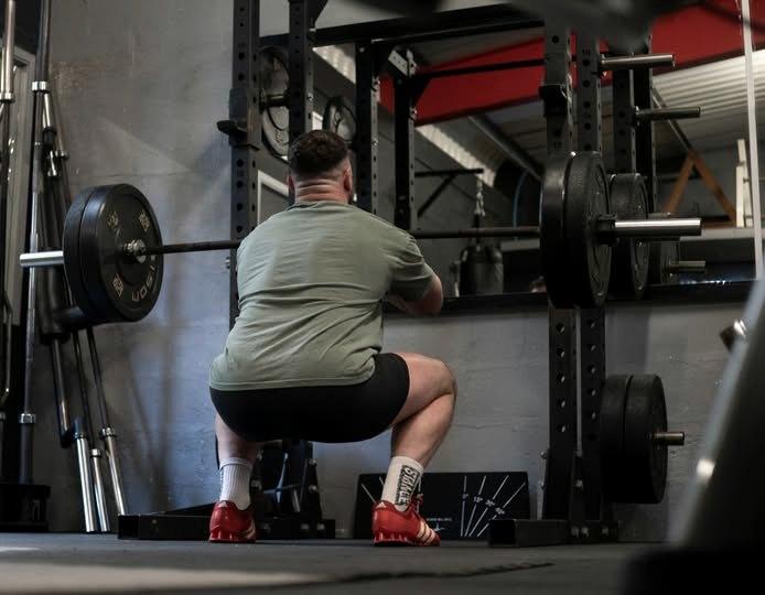 A member squatting in the rack